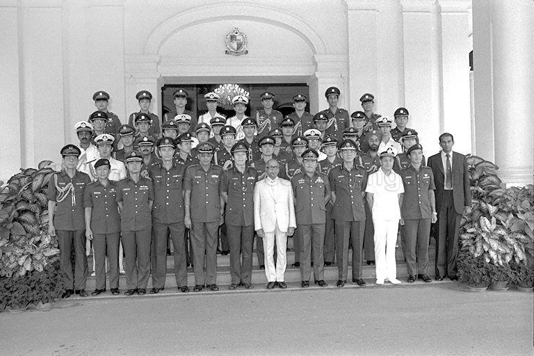 Group photograph of President Devan Nair with aides-de-camp and senior police, navy and army officers after the certificates of appointment presentation at Istana