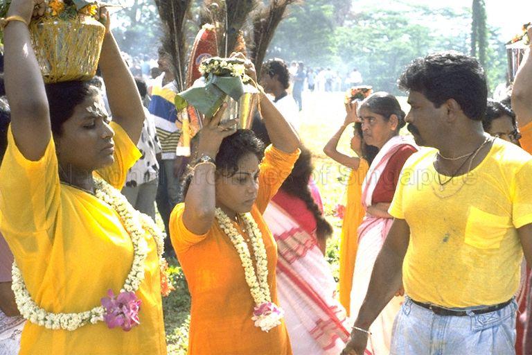 Women carrying milk pots decorated with flowers as offerings to Lord Murugan during the Panguni Uthiram Festival which is being celebrated on the full moon of the Tamil month of Panguni at the Holy Tree Sri Balasubramaniam Indian Temple in Canberra Road. The temple has relocated to Yishun Industrial Park A, Yishun Avenue 7.