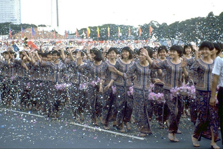 National Day Parade 1990 at the Padang -- Singapore Airlines (SIA) contingent throwing confetti