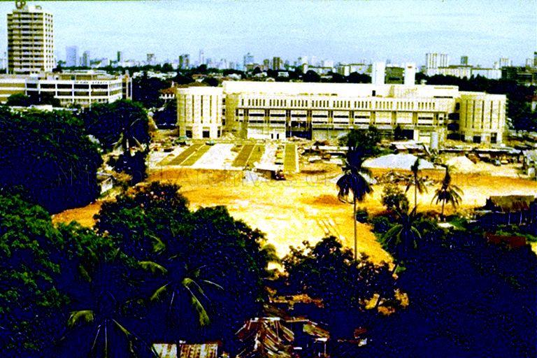 The Tanjong Katong Complex and public carpark under construction and viewed from one of the Housing Development Board (HDB) flats at Geylang Serai. On the left is another shopping centre, City Plaza. The Tanjong Katong Complex occupies what was once a Malay settlement at Lorong Engku Aman