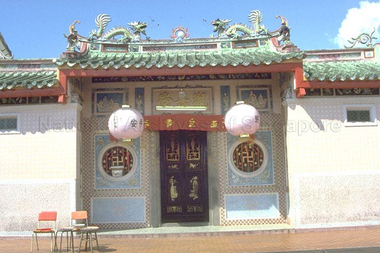 Kuan Im Tng Temple (Joo Chiat) at 62 Tembeling Road. Built in 1921, the Chinese temple featured an ornate facade including traditional circular windows surrounded by yellow, white and blue mosaic symbols of the Eight Immortals, and its roof ridges adorned with statues of dancing dragons with the celestial pearl symbolising prosperity and good fortune.