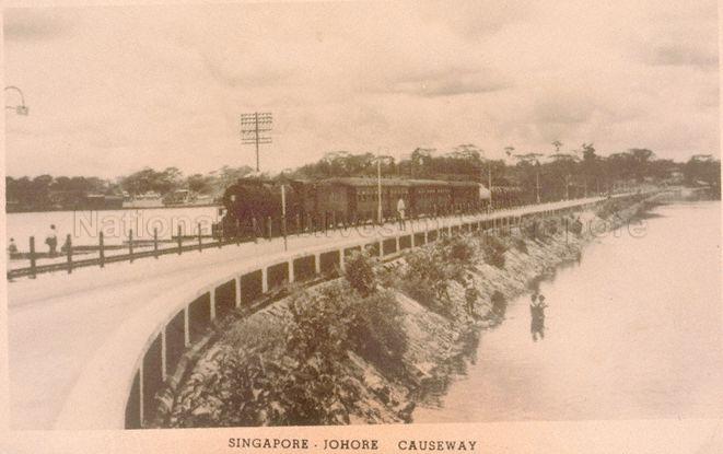 The Causeway linking Singapore and Malaya, completed in 1923 and officially opened on 28 June 1924 at Johor Bahru of Malaya. In this picture, people are fishing near the Causeway culvert.
