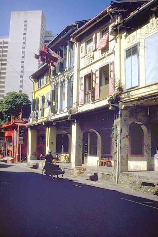 Shophouses along Amoy Street. Siang Cho Keong Temple can be seen at the end of the street with Ministry of National Development (MND) Building in the background.