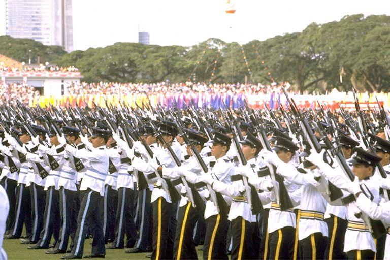 National Day Parade 1984 at the Padang -- Feu-de-joie by guard of honour contingents from Singapore Police Force (SPF) and Republic of Singapore Air Force (RSAF)