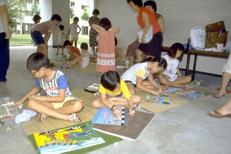 Children playing with crayons; picture taken during Minister for Foreign Affairs and Minister for Culture S Dhanabalan's tour of Kampong Chai Chee and Siglap constituencies