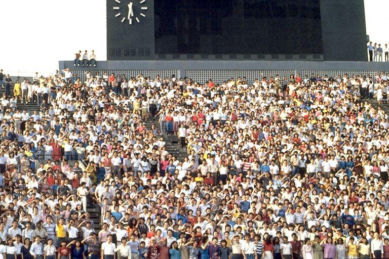 Crowd at A Salute to Singapore party at the National Stadium. The party was the finale for the Salute to Singapore book project organised by Times Organisation to celebrate 25 years of self-rule in Singapore. Only 25-year-olds were invited and about 7,000 showed up for the party and mass group photo.