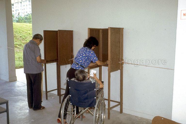 General Election 1984 - People casting their vote at polling station at Housing Development Board (HDB) apartment block void deck