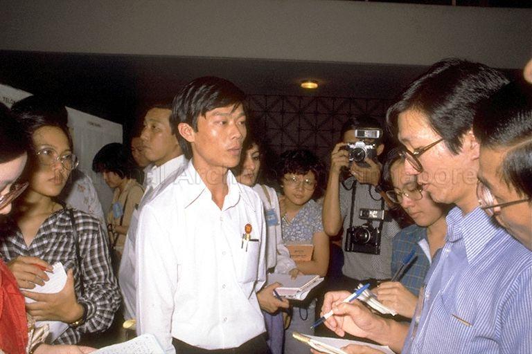 Political party official speaking to the media at nomination centre for 1980 General Election at Singapore Conference Hall