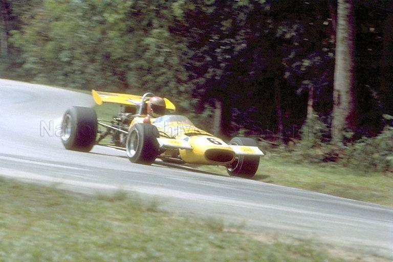 View of winner of the 7th Singapore Grand Prix Max Stewart of Australia racing in his mustard Mildren, at Thomson Road circuit