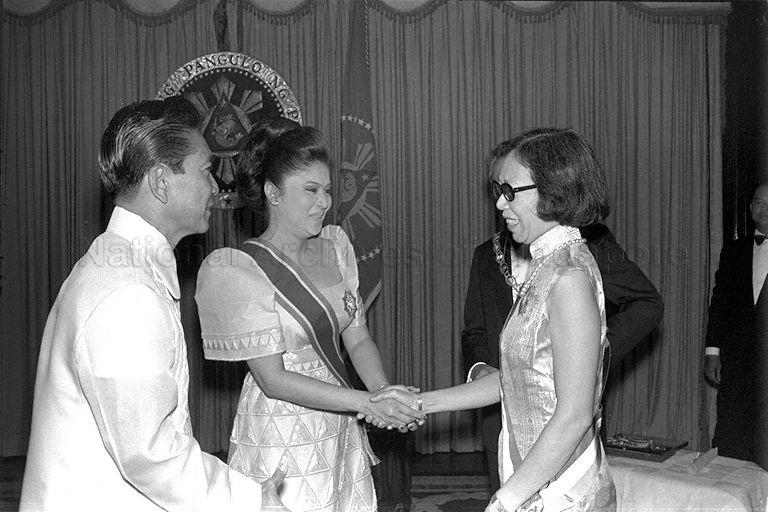 Mrs Imelda Marcos, wife of President Ferdinand Marcos of the Philippines, congratulating Mrs Lee Kuan Yew after presenting her with the Order of the Golden Heart, a decoration given in recognition of her humanitarian work, at state dinner at Malacanang Palace. The dinner, at which Prime Minister (PM) Lee Kuan Yew was also conferred the Ancient Order of Sikatuna (Rank of Rajah) by the President, was held in honour of three-day visit by PM Lee.