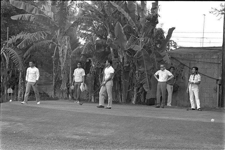 Prime Minister Lee Kuan Yew and President Ferdinand Marcos of the Philippines (3rd from left) having a game of golf, during PM Lee's three-day official visit to Manila.