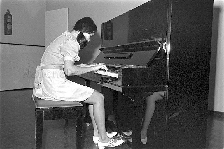 Ong Tek Loen playing the piano at the second Music for the Young concert at the National Library Lecture Hall.