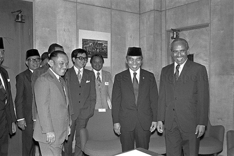 Minister for Foreign Affairs S Rajaratnam and his Indonesian counterpart Adam Malik with officials at Ministry of Foreign Affairs, where the signing ceremony of basic agreement on economic and technical co-operation between Governments of Singapore and Indonesia is held. On the left is Singapore Ambassador to Indonesia Lee Khoon Choy. The agreement was signed during Indonesian President Suharto's state visit to Singapore.