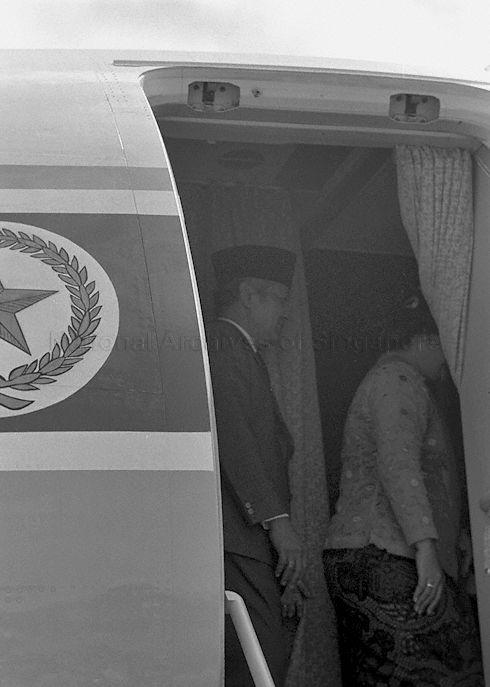 Mrs Tien Suharto, wife of the Indonesian President, proceeding into the plane after the President's three-day state visit to Singapore