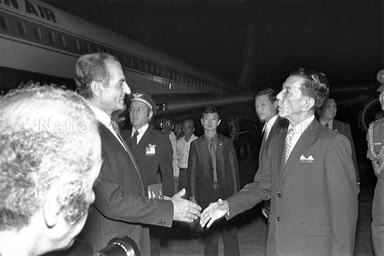 Shah Mohammad Reza Pahlavi of Iran, who arrives in Singapore for a three-day official visit, being greeted by President Dr Benjamin Henry Sheares at Paya Lebar Airport
