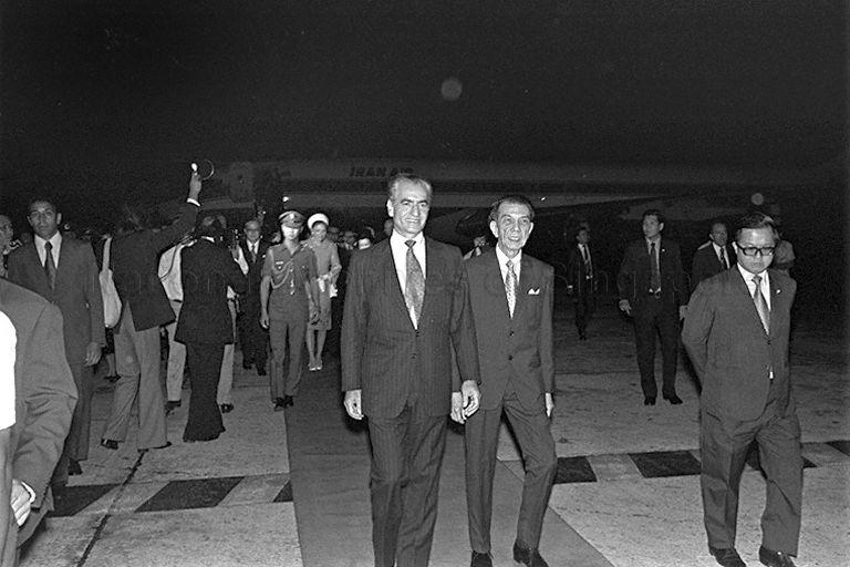 Shah Mohammad Reza Pahlavi of Iran, who arrives in Singapore for a three-day official visit, with President Dr Benjamin Henry Sheares walking along the red carpet at Paya Lebar Airport