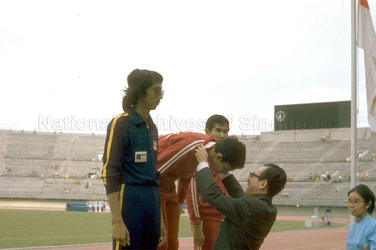 Medal presentation for athletics event at Seventh Southeast Asian Peninsular (SEAP) Games at National Stadium