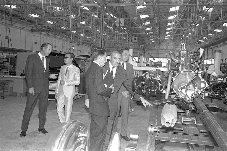 President Dr Benjamin Henry Sheares touring a motor car assembly plant during visit to Jurong Industrial Estate as part of a familiarisation tour. With him on the tour are Minister of State for Finance Tang See Chim and Chairman of Jurong Town Corporation Woon Wah Siang.