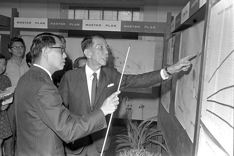 President Dr Benjamin Henry Sheares, who is also Chancellor of University of Singapore, is briefed by Director of Development Unit of University of Singapore Ho Pak Toe on the phases of work to be carried out for Kent Ridge campus during a visit to the University of Singapore campus at Bukit Timah.