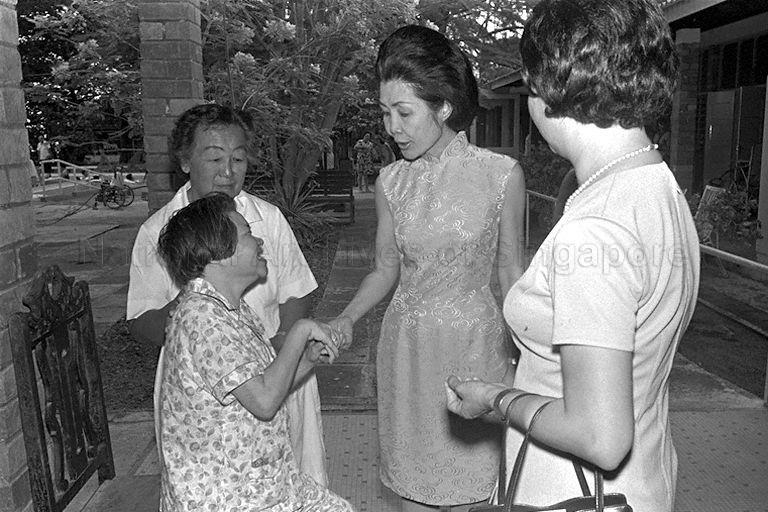 First Lady Madam Yeo Seh Geok (centre) is greeted at the Cheshire Home.
