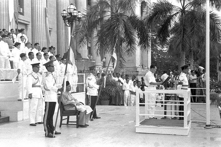 Prime Minister Lee Kuan Yew delivering his address at City Hall steps before introducing the newly appointed Head of State Yang Di-Pertuan Negara Yusof Ishak during launch of National Loyalty Week