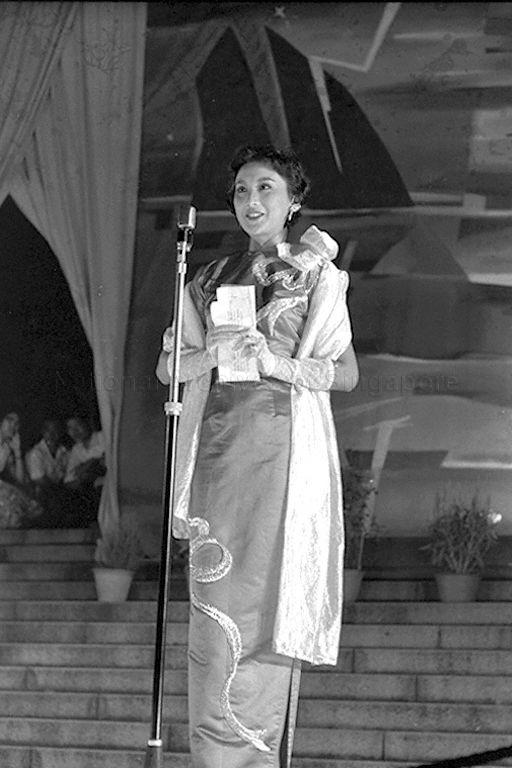 Photo of Hong Kong actress and producer Hsia Moon/Xia Meng. She was the top leading lady of Hong Kong Great Wall Movie Enterprises, Hong Kong largest left wing film studio. Six famous stars of the Great Wall Film Studio were invited by the Singapore Press Association to participate in a series of events of the National Loyalty Week.
