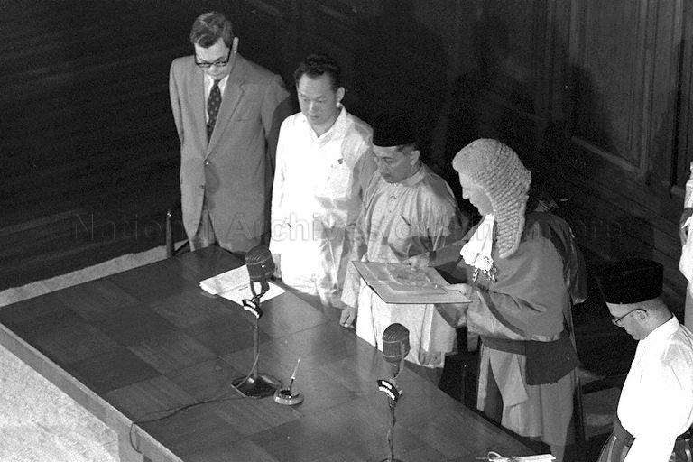 Installation of first Malayan-born Yang Di-Pertuan Negara Yusof bin Ishak in the presence of Chief Justice Sir Alan Rose witnessed by Prime Minister Lee Kuan Yew and Speaker of Legislative Assembly Sir George Oehlers and State Advocate-General Ahmad Ibrahim (right) at City Hall Chambers