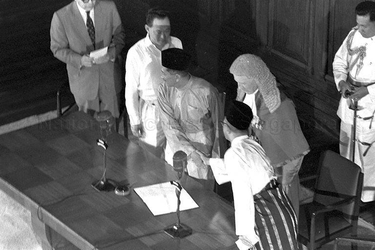 Installation of first Malayan-born Yang Di-Pertuan Negara Yusof bin Ishak in the presence of Chief Justice Sir Alan Rose witnessed by Prime Minister Lee Kuan Yew and Speaker of Legislative Assembly Sir George Oehlers and State Advocate-General Ahmad Ibrahim (right) at City Hall Chambers