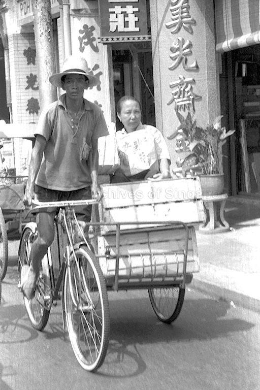 A trishaw rider and his passenger