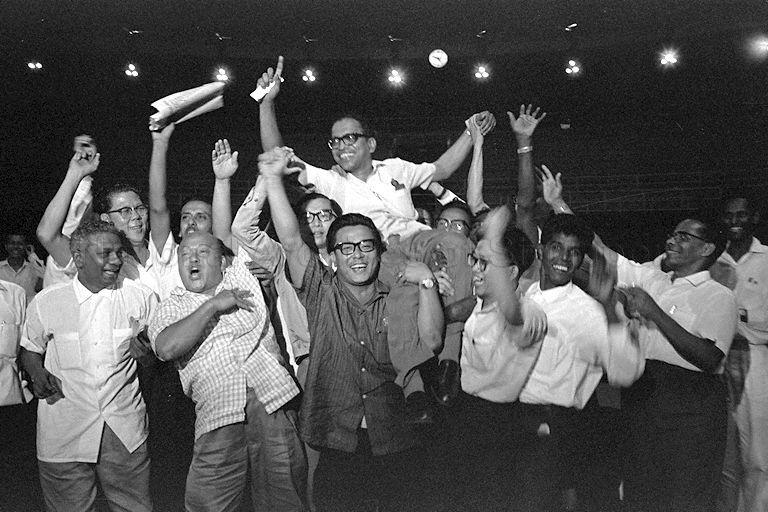 Devan Nair of People's Action Party (PAP) chaired by supporters after winning the Bungsar seat in Kuala Lumpur, during the Malaysian general election held in West Malaysia
