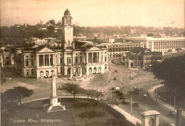 View of Empress Place, Singapore. On the left in the foreground is the Dalhousie Obelisk and buildings (from left) include Victoria Theatre and Memorial Hall, the Europe Hotel, Municipal Building (now City Hall) and Singapore Cricket Club (centre, right).
