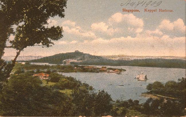 Keppel Harbour from the eastern ridge of Mount Faber, Singapore. The chimneys on Pulau Brani were part of Straits Trading Company's tin smelter. Pulau Blaking Mati (now Sentosa) is in the background.