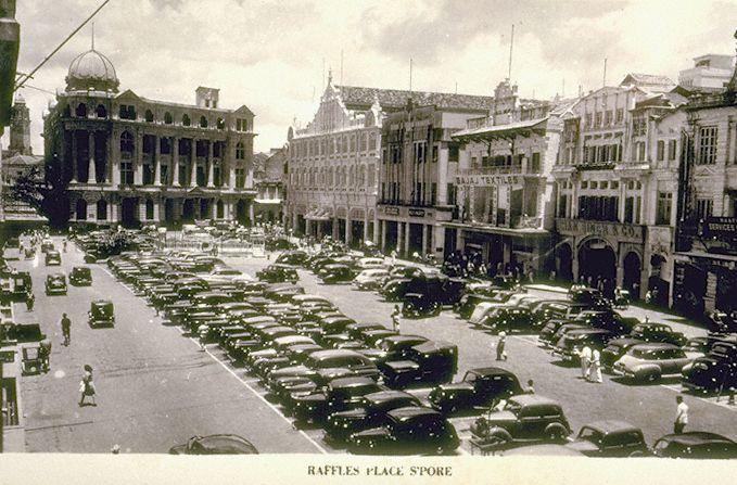 View of Raffles Place with Chartered Bank Building (left) and John Little next to it, Singapore