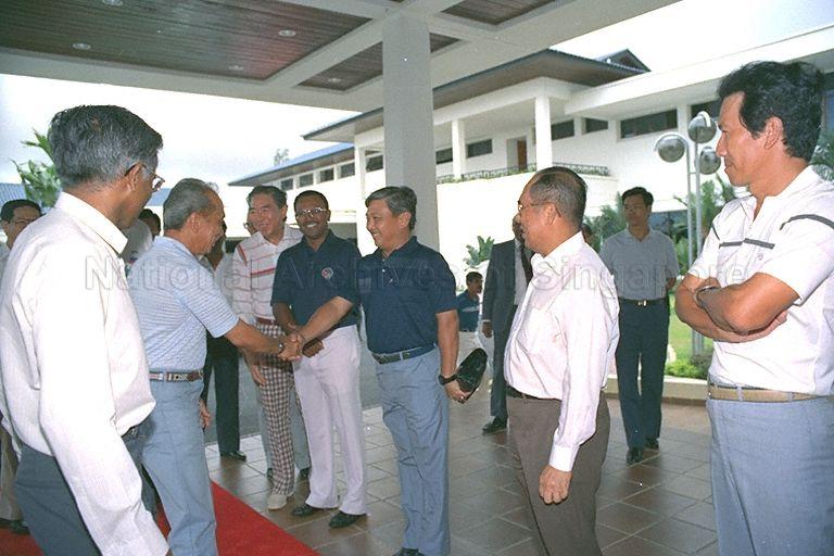 The Yang di-Pertuan Agong of Malaysia, Sultan Iskandar of Johor, being greeted on his arrival for lunch at Raffles Country Club in Tuas. Among those in the line-up (from right) are Police Commissioner Goh Yong Hong (first), (third to fifth) Singapore Armed Forces (SAF) Chief of General Staff Lieutenant-General Winston Choo, Member of Parliament for Chong Boon S Chandra Das, and Speaker of Parliament Dr Yeoh Ghim Seng. At left (front) is Director of Protocol and Consular Division of Ministry of Foreign Affairs V K Rajan. Behind him in the background is Second Deputy Prime Minister Ong Teng Cheong (partial face only).