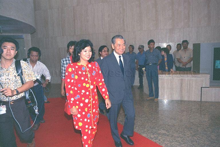 Tunku Mariam Zahrah (red baju kurung), daughter of the Yang di-Pertuan Agong of Malaysia, Sultan Iskandar of Johor, arriving to visit Housing Development Board (HDB) at HDB Centre, Bukit Merah Central. With her is HDB Chairman Hsuan Owyang.