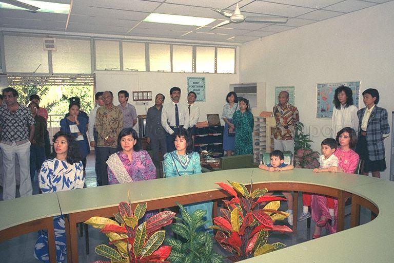 Malaysian princesses Tunku Besar Zabedah (seated right) and Tunku Mariam Zahrah (seated, third from left), daughters of the Yang di-Pertuan Agong, Sultan Iskandar of Johor, and two nephews - (from right) Tengku Sallehuddin Ismail Iskandar Ibrahim Hishamuddin Shah and Tengku Shahrain, being briefed by Chairman of Darul Ihsan Lilbanet orphanage Almuddin Hashim, at 23 Wan Tho Avenue, off Upper Serangoon Road, on the activities of the two orphanages run by the Muslim Trust Fund Association.