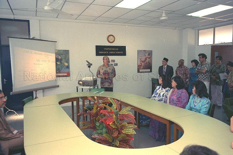 Malaysian princess Tunku Mariam Zahrah (seated right), daughter of the Yang di-Pertuan Agong, Sultan Iskandar of Johor, being briefed by Chairman of Darul Ihsan Lilbanet orphanage Almuddin Hashim (centre), at 23 Wan Tho Avenue, off Upper Serangoon Road, on the activities of the two orphanages run by the Muslim Trust Fund Association.