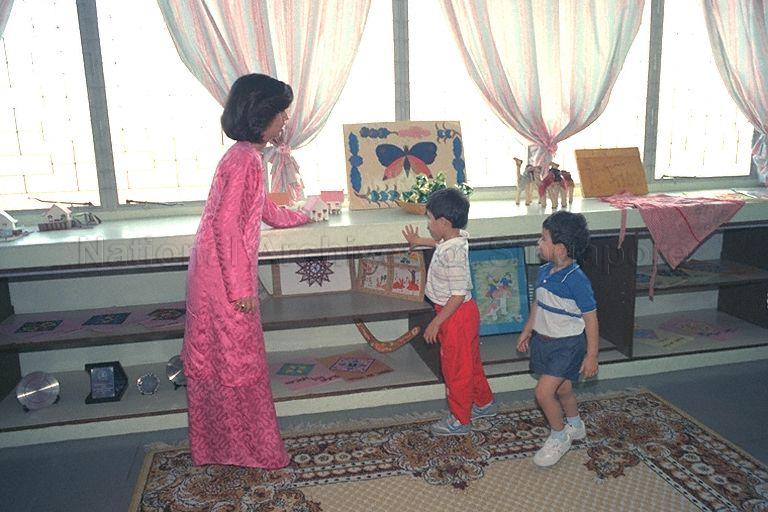 Malaysian princess Tunku Besar Zabedah (left), daughter of the Yang di-Pertuan Agong, Sultan Iskandar of Johor, and her two nephews - Tengku Sallehuddin Ismail Iskandar Ibrahim Hishamuddin Shah (centre) and Tengku Shahrain (right), touring Darul Ihsan Lilbanet all-girls orphanage at 23 Wan Tho Avenue, off Upper Serangoon Road.