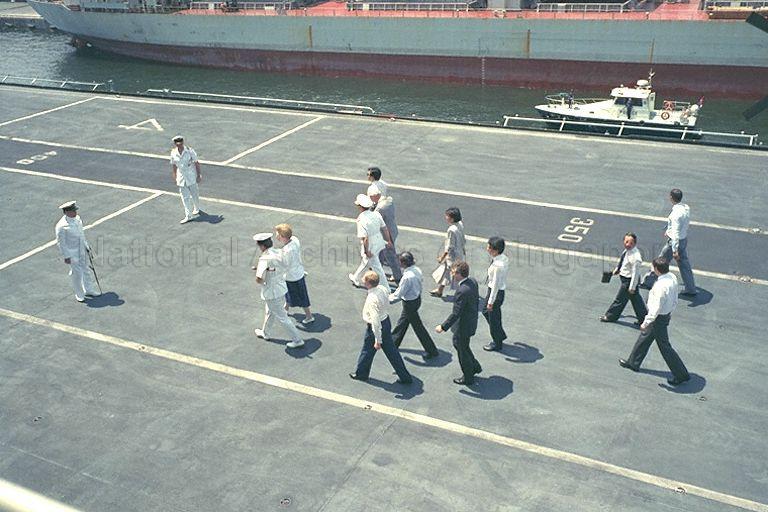 British Prime Minister Mrs Margaret Thatcher taking a helicopter ride from the Defence Ministry headquarters to visit HMS Ark Royal, a British aircraft carrier berthed at Sembawang. She is received by Rear Admiral Peter Woodhead. Mrs Thatcher is accompanied by her husband Denis Thatcher, Minister for Home Affairs and Second Minister for Law Professor S Jayakumar, and British High Commissioner to Singapore Michael Edmund Pike.