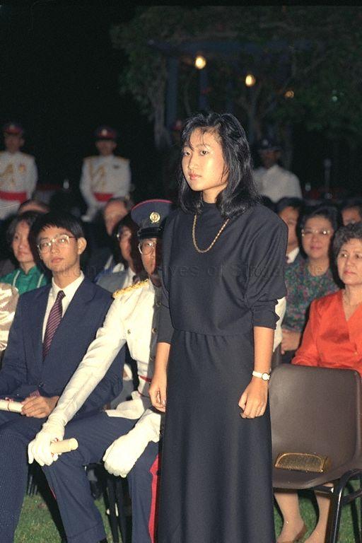 Valerie Thean Pik Yuen (standing), daughter of Justice L P Thean, getting ready to receive the most prestigious local scholarship from President Wee Kim Wee at Istana. She will read law at Cambridge. To her right are scholars Teh Laik Woon (partially hidden) and Patrick Tan Boon Ooi.
