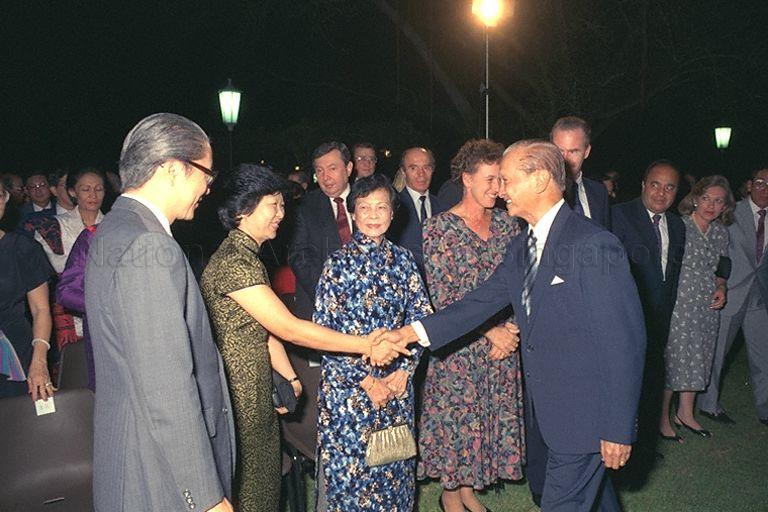 President Wee Kim Wee congratulating Minister for Education Dr Tony Tan (front, left) and Mrs Mary Tan, parents of President's Scholar Patrick Tan Boon Ooi, during President's Scholarship awards presentation at Istana.