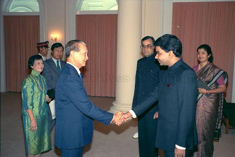 President Wee Kim Wee meeting Indian diplomat after receiving credentials from High Commissioner Yogesh Mohan Tiwari (third from right) at Istana. Looking on are Mrs Wee (left) and Mrs Tiwari (right).