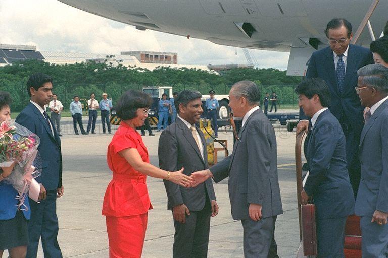 (From left) Mrs Christine Dhanabalan (third), wife of Minister of National Development S Dhanabalan (fourth), welcoming Japanese Prime Minister Noboru Takeshita at Changi International Airport for a two-day state visit to Singapore. At right is Director of Protocol and Consular Division, Ministry of Foreign Affairs V K Rajan. Standing on the aircraft ramp are Japan's Ambassador to Singapore Wasuke Miyake (left) and Mrs Takeshita (right, face only).