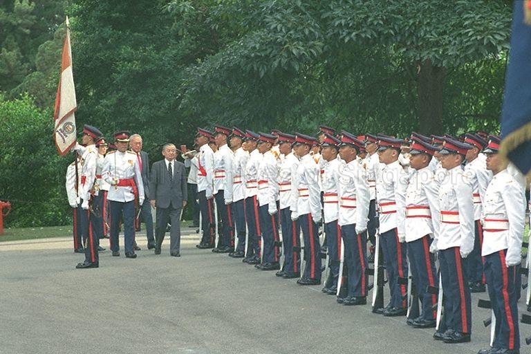 Japanese Prime Minister Noboru Takeshita, accompanied by Prime Minister Lee Kuan Yew, inspecting guard of honour formed by the twenty-first Singapore Artillery during the ceremonial welcome at Istana.