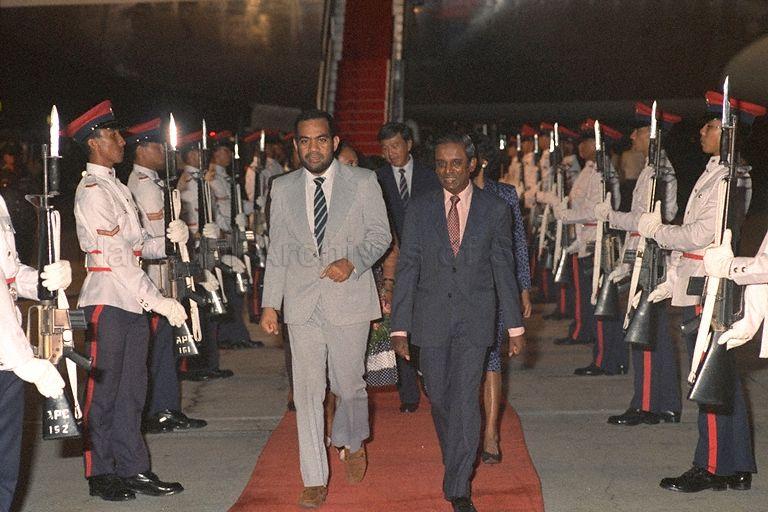 President of the Republic of Kiribati Ieremia Tabai (left) and Mrs Tabai (left, hidden) arriving at Singapore Changi Airport. With them are Minister for Law and Home Affairs Professor S Jayakumar (right) and Mrs Jayakumar (right, partly hidden). Mr Tabai is stopping over on his way to the October 18-24 Commonwealth Heads of Government Meeting (CHOGM) in Kuala Lumpur.