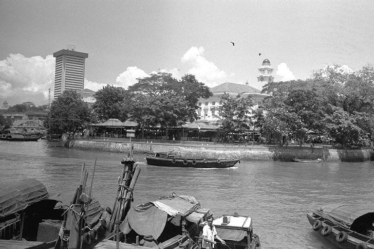 Empress Place Food Centre situated behind Empress Place Building. On the right in the background is clock tower of Victoria Theatre.