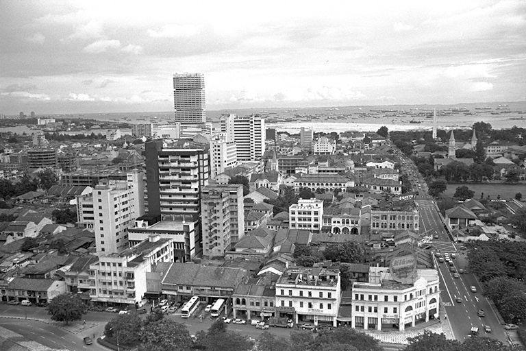 Bird's eye of Bras Basah Road from Cathay Building. The tall building on the left is Shaw Tower with Prinsep Street in the foreground. Visible in the background to the right are Civilian War Memorial, steeples of Convent of the Holy Infant Jesus (CHIJ) Chapel and Cathedral of the Good Shepherd.