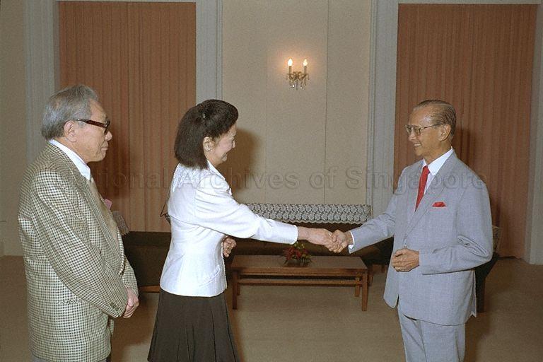 Japanese fashion designer Hanae Mori, accompanied by her husband Ken Mori, greeting President Wee Kim Wee during a courtesy call in the Istana