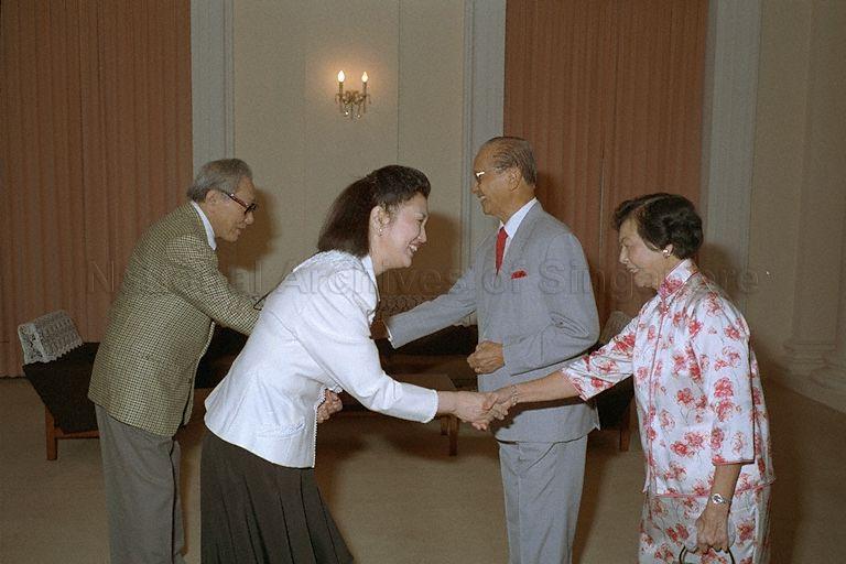 President Wee Kim Wee and the First Lady greeting Japanese fashion designer Hanae Mori and her husband, Ken Mori, during a courtesy call in the Istana