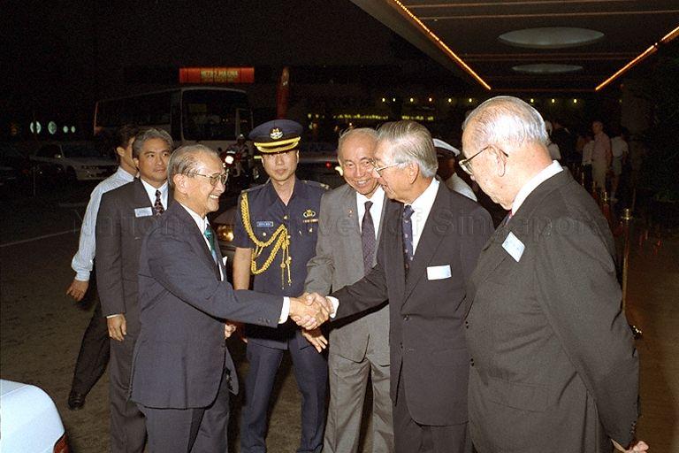 Guest of honour, President Wee Kim Wee going through a